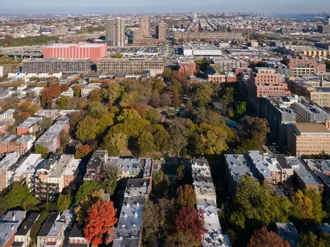 Flat roofs of rowhouse blocks around Hamilton Park in Jersey City, seen from the air