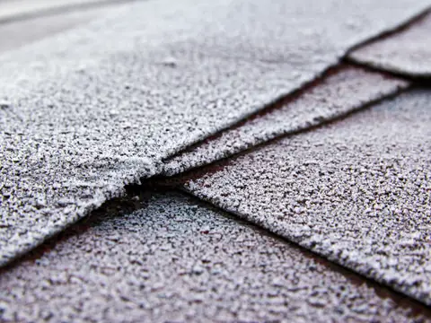 Close-up of overlapping asphalt shingles